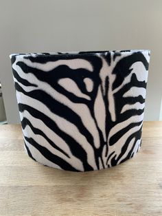 Take a walk on the wild side with this zebra wild animal print drum lampshade.  This is a great polyester tactile; suede feel textured fabric with a soft pile for that luxurious soft touch. The shade comes in 4 sizes.  20cm diameter x 18cm high  25cm diameter x 20cm high 30cm diameter x 20cm high 40cm diameter x 25cm high If you require a different size or shape to those on offer, please ask, I may be able to help you.  Overseas buyers, if you require a shade 40cm in diameter or bigger please co Zebra Ottoman, Zebra Hide Ottoman, Zebra Lamp, Zebra Patterned Ottoman, Animal Print Lampshade, Fur Fabrics, Drum Lampshade, Harp, Fabric Width