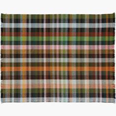 a multicolored plaid rug with fringes