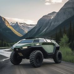 an off - road vehicle driving down a dirt road in the mountains