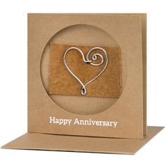 a brown card with a heart on it and the words happy anniversary written in white