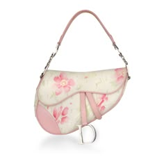 If you're a lover of vintage pieces, this Floral Saddle bag created by John Galliano is a great collectors piece to have in your wardrobe. Although the Dior Saddle was reinvented in 2018, the vintage models are hardwearing and durable. The floral print makes this piece feminine and delicate, whilst being a great size to fit your bare essentials. SPL Exterior Floral fabric exterior Silver hardware Pink leather trim and shoulder strap Hanging D charm Velcro closure 2003 production Good condition - some fading and discolouring to the fabric. Some tarnishing and scratches to the hardware and D logo. Some rubbing to the leather Interior Pink oblique canvas lining Single storage compartment One zip pocket Dior leather embossed logo Fair condition - some staining inside and slight odour Sold with Vintage Saddle Bag, Dior Floral, D Logo, Dior Saddle, Vintage Christian Dior, Dream Bags, Girly Bags, Baby Phat, Fancy Bags