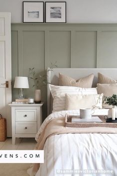 a bed with white sheets and pillows in a bedroom next to two pictures on the wall