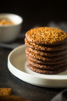 a stack of cookies sitting on top of a white plate