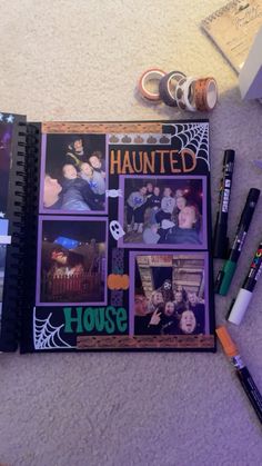 an open halloween scrapbook with pictures and pens on the floor next to it is surrounded by other items