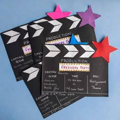 three black and white paper stars on top of each other with the words production written on them