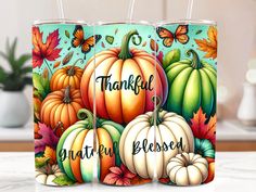 three pumpkins with the words, thank you and autumn blossoms on them are sitting on a marble countertop