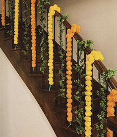 a staircase decorated with yellow and orange flowers