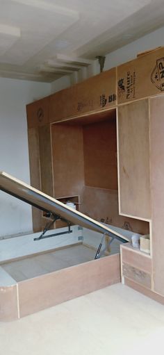 the kitchen cabinets are being built and ready to be installed