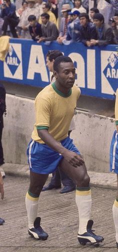 two soccer players in yellow and blue uniforms