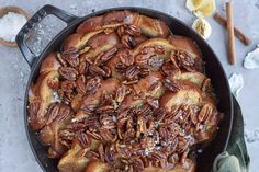 a skillet filled with pecans and cinnamons