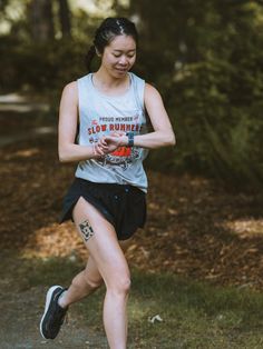 a woman is running in the park