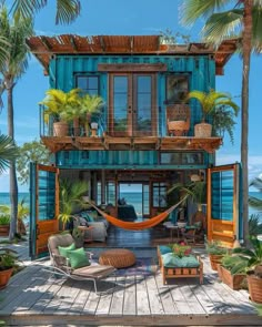 a blue shipping container house with hammock chairs and palm trees on the deck