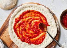 homemade pizza dough with sauce in the middle