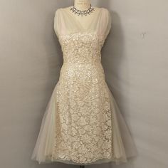 Gorgeous And Unusual, High Quality Vintage Dress. Pale Blush Pink With Cream. Estimated Fifties/Sixties. Overall Good Condition, With One Panel Of Pink Netting Missing (See Pic). For Sizing Please Go By Measurements, Shown On An 8 ( Nice Fit, Some Room) And A 6 Dress Form (Loose). Length Is 48", Bust 38", Waist 30", Hips 40". Label Is Fredleys, . . .Boston, Providence, Wellesley. Unique Find. Feminine, Romantic, Ethereal. Well Worth The Small Repair Or Very Wearable As Is. Cream Tulle Dress With Sheer Bodice, Garden Party Tulle Dress With Lace Patchwork, Evening Cream Tulle Dress, Summer Wedding Lace Dress With Illusion Neckline, Cream Dress With Sheer Bodice For Evening, Sheer Sleeveless Lace Wedding Dress, Spring Evening Tulle Lace Dress, Ethereal Sleeveless Party Dress, Feminine Tulle Evening Dress For Cocktail