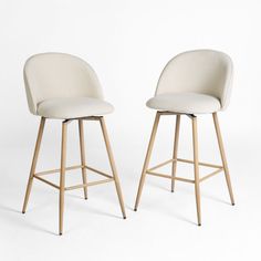 two white stools with wooden legs are facing each other in front of a white background