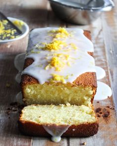 a loaf of lemon pound cake sitting on top of a wooden table