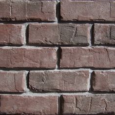 a brick wall that is made out of red bricks