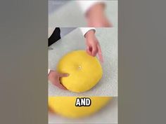 the person is kneading dough on top of an orange and then placing it into a bowl