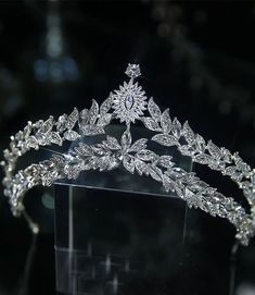 a tiara is displayed on a clear display case