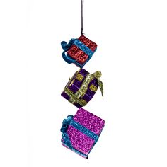 three christmas presents hanging from a string on a white background in the shape of an ornament