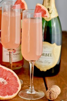 two glasses filled with pink wine and grapefruit