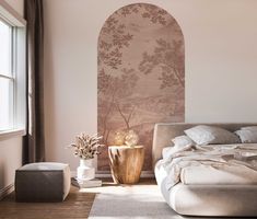 a bedroom with a large bed and wallpaper on the walls, along with two vases