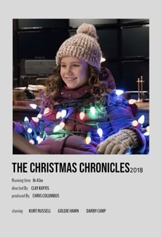 the christmas chronicles poster with a girl in a knitted hat and lights