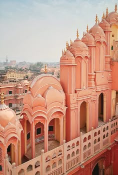 an aerial view of some buildings in the middle of india, including one building with arches and domes