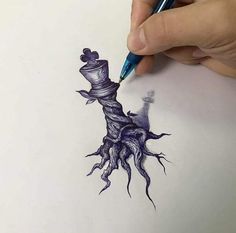 someone is drawing a tree with a pencil