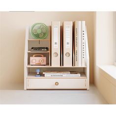 a book shelf with books and other items on it