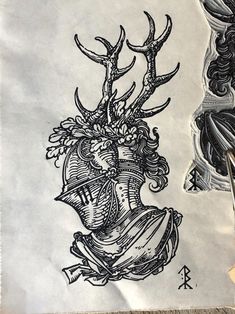 a drawing of a head with horns and flowers on it