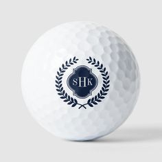 a white golf ball with the s h logo on it