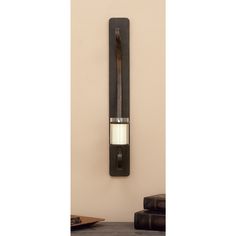 a wall mounted wine bottle holder on the side of a wall