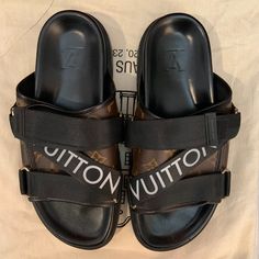 Comes With A Lv Box Never Worn Dm A Reasonable Price-No Low Balls (This Is The Same Listing As The One That Is Marked As “Sold”, That Order Was Cancelled And Posh Won’t Remove It) Luxury Leather Trim Sandals For Summer, Luxury Sandals With Leather Trim For Summer, Luxury Brown Slides With Leather Sole, Designer Open Toe Sandals With Leather Trim, Luxury Leather Sandals With Leather Trim, Designer Black Sandals With Logo Strap, Luxury Brown Slides, Luxury Slides With Removable Insole, Luxury Leather Sole Slides With Round Toe