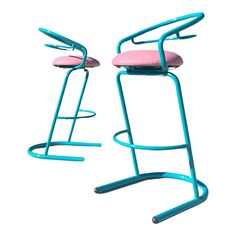 two pink and blue stools sitting next to each other