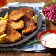 the meal is ready to be eaten on the table, including fish and coleslaw