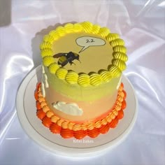 there is a cake that has been decorated with an image of a bee on it