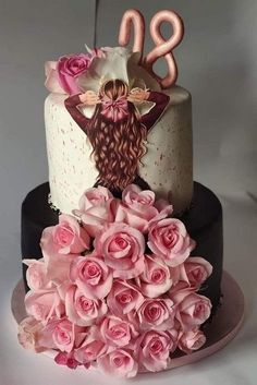 a three tiered cake decorated with pink roses and the number twenty two on top