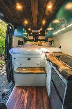 the interior of a camper van with wood flooring