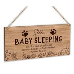 a wooden sign that says, she is baby sleeping and excited dog please do not knock or ring the bell call or exit