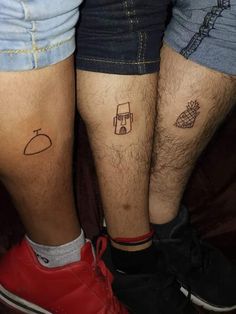 two people with matching tattoos on their legs