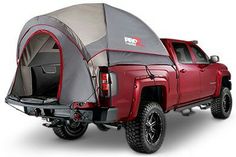 a truck with a tent attached to it's bed