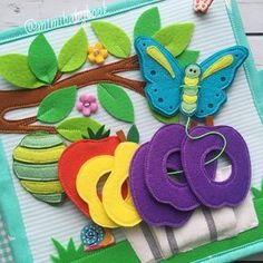 an appliqued card with the word abcq on it and a butterfly