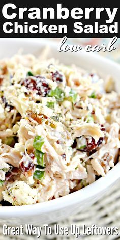 a white bowl filled with chicken salad on top of a woven table cloth and text overlay that reads cranberry chicken salad low carb