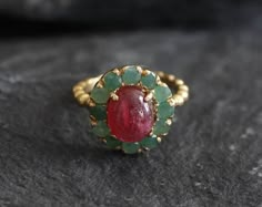 Gold Ruby Ring set with Natural Ruby in a smooth cut & natural red color, at 10x8mm, 3 Carats, sourced from Burma. Surrounded with Natural Emeralds in a diamond cut at 3mm, from Colombia. Victorian Ring design made of Solid 925 Sterling Silver ☞ made to last.**The ring is plated with 18k Gold (the thickest plating - 3 Micron) over Solid 925 Sterling Silver.Matching Pendant & Earrings - please ask meJuly & May Birthstone - Genuine & Natural Stones ❀☞ Choose your size ☞ I resize (b 18k Diamond Ring, Silver Vintage Ring, Ruby And Emerald Ring, Rubi Ring, Real Ruby Rings, Ruby Ring Designs, Antique Ruby Ring, Ruby Ring Set, Gold Ruby Ring