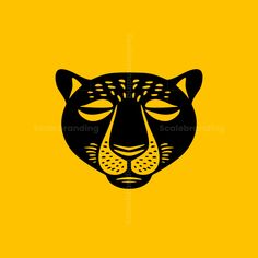 a black and yellow tiger's face on a yellow background