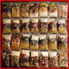 a display case filled with lots of different types of food in plastic bags on top of a red frame