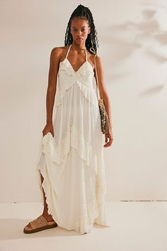 So romantic and ethereal, this stunning maxi from our free-est collection will turn heads with every wear. **Fit:** Relaxed, billowy silhouette **Features:** V-neckline, asymmetrical ruffle trimming throughout, tie-back neckline, backless design with adjustable tie **Why We | Santa Luz Maxi Dress by free-est at Free People in White, Size: M Free People Maxi, Crochet Maxi Dress, Halter Maxi Dresses, Eyelet Dress, White Maxi, Lace Midi Dress, Beach Wedding Dress, White Maxi Dresses, Free People Dresses