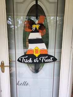 a door with a sign that says trick or treat