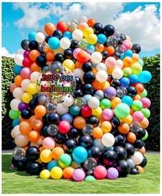 a large bunch of balloons in the shape of a tree